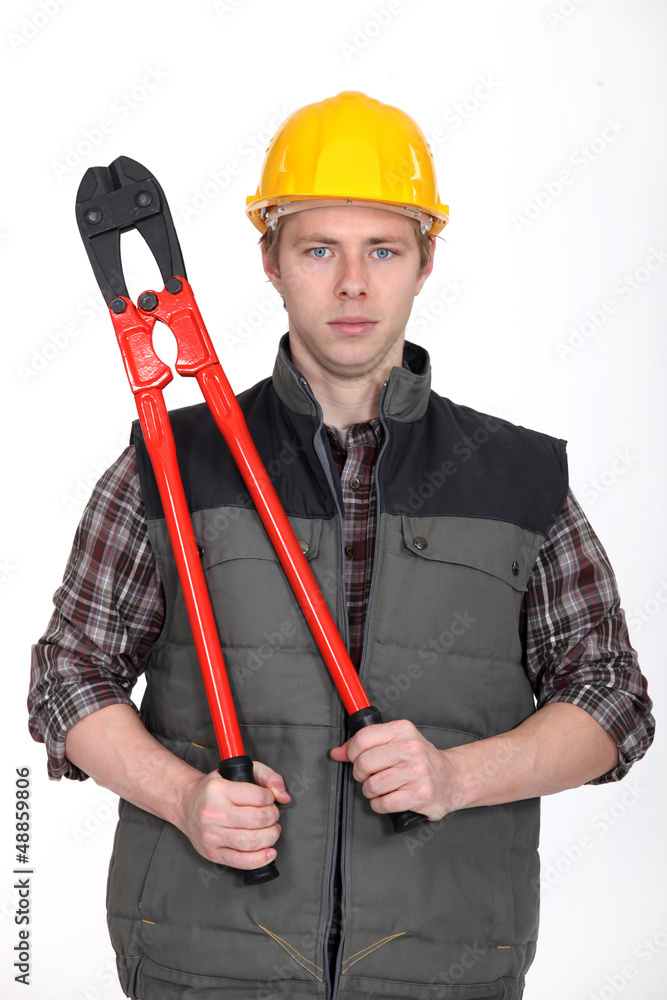 Tradesman holding large clippers Tradesman holding large clippers
