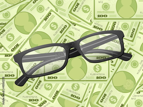 reading glasses on dollar background