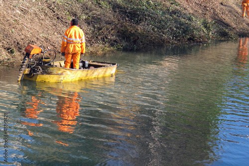 boat with a warden with the Orange jumpsuit during the crossing