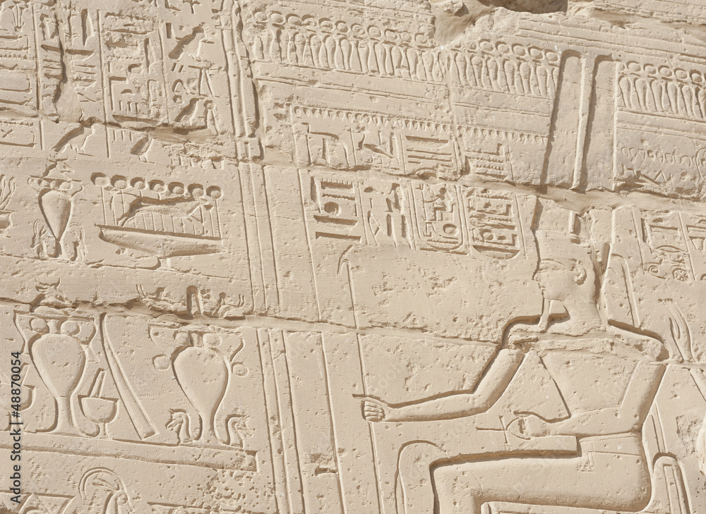 Egyptian hieroglyphic carvings on wall