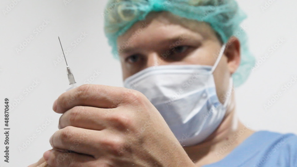 Doctor with syringe Doctor with syringe