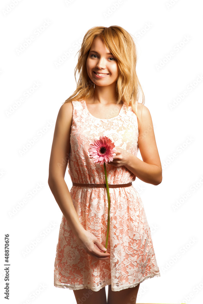 Attractive blonde woman holding a flower Attractive blonde woman holding a flower