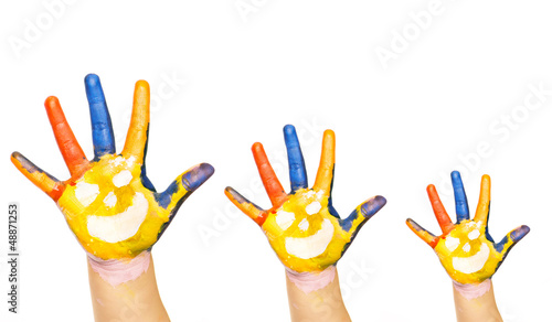 Three colorful hands with smiling face of family