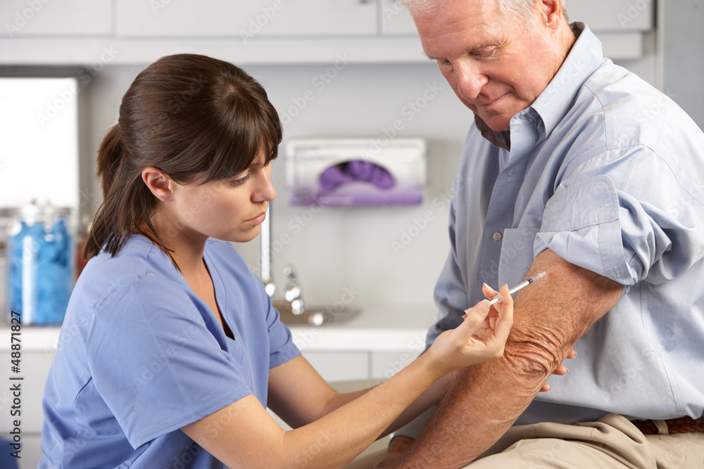 Fototapeta premium Doctor Giving Male Patient Injection