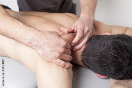 physical therapist applying myofascial therapy