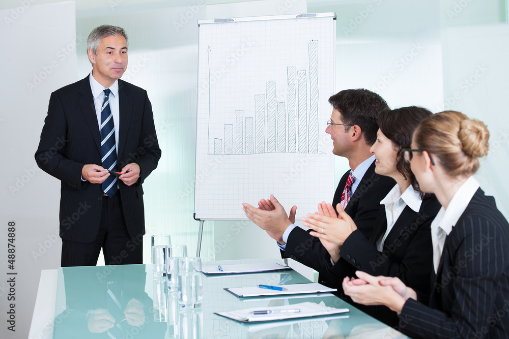Colleagues clapping after a staff presentation Colleagues clapping after a staff presentation