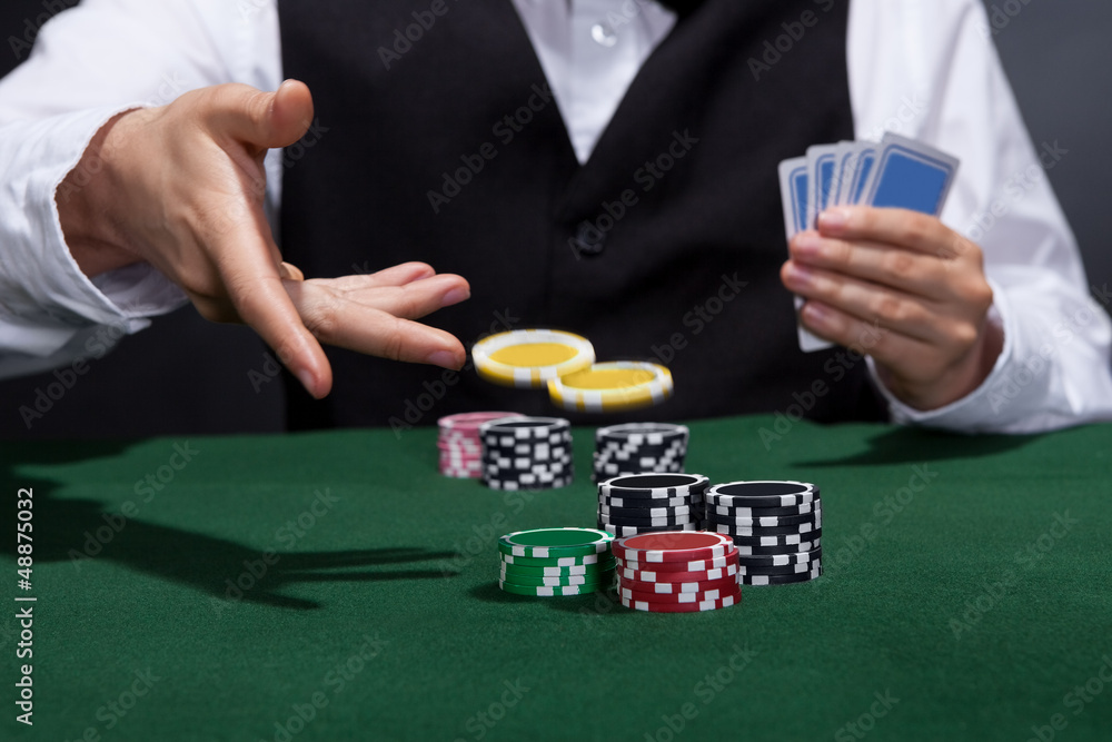 Poker player increasing his stakes Poker player increasing his stakes