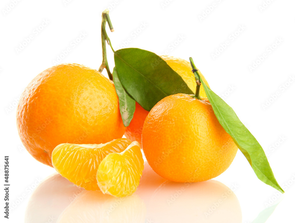 Ripe sweet tangerine with leaves, isolated on white Ripe sweet tangerine with leaves, isolated on white