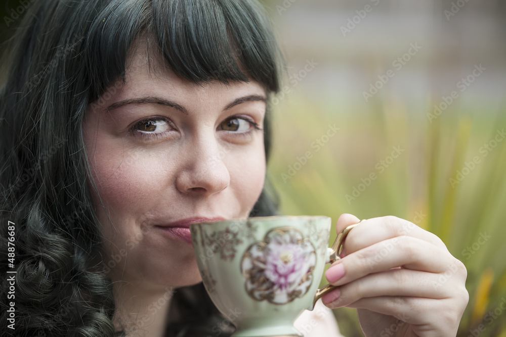 Young Woman with Antique Tea Cup
