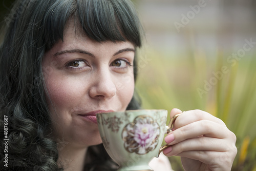 Obraz na płótnie Young Woman with Antique Tea Cup w salonie
