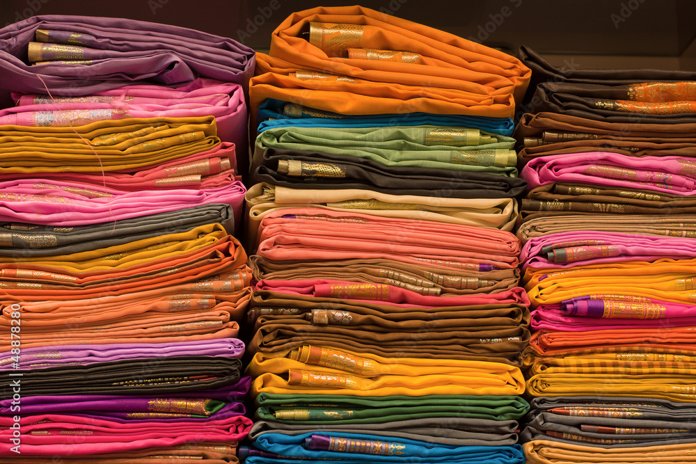Heap of cloth fabrics at a local market in India. Heap of cloth fabrics at a local market in India.
