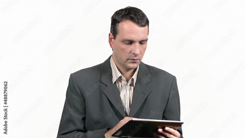 Businessman working on tablet and answering phone call Businessman working on tablet and answering phone call
