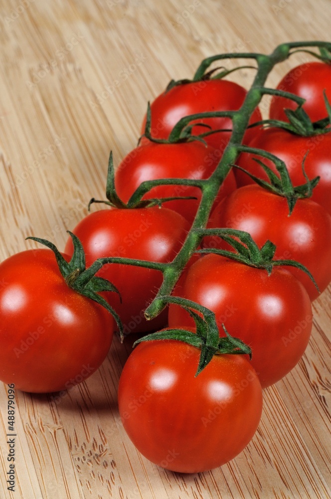 Cherry tomatoes on vine © Arena Photo UK Cherry tomatoes on vine © Arena Photo UK