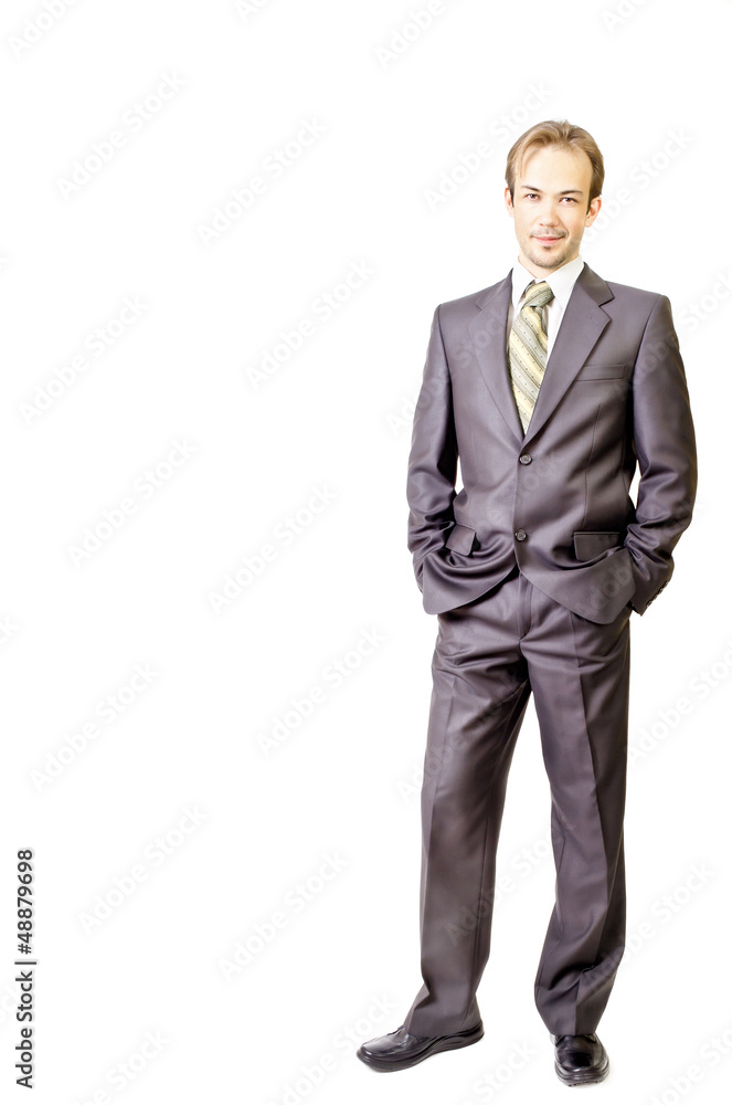 Young businessman keeps hands in pockets Young businessman keeps hands in pockets
