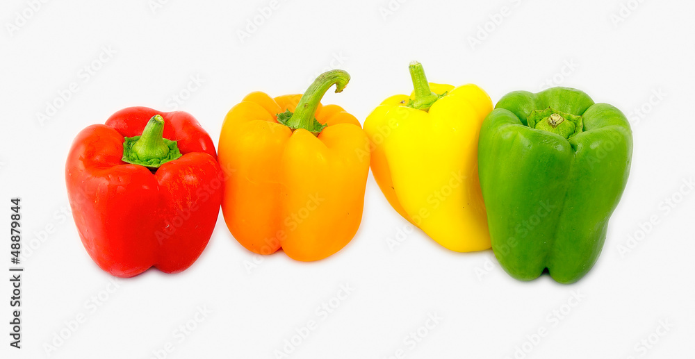 A mix of differently colored bell peppers isolated on white back A mix of differently colored bell peppers isolated on white back