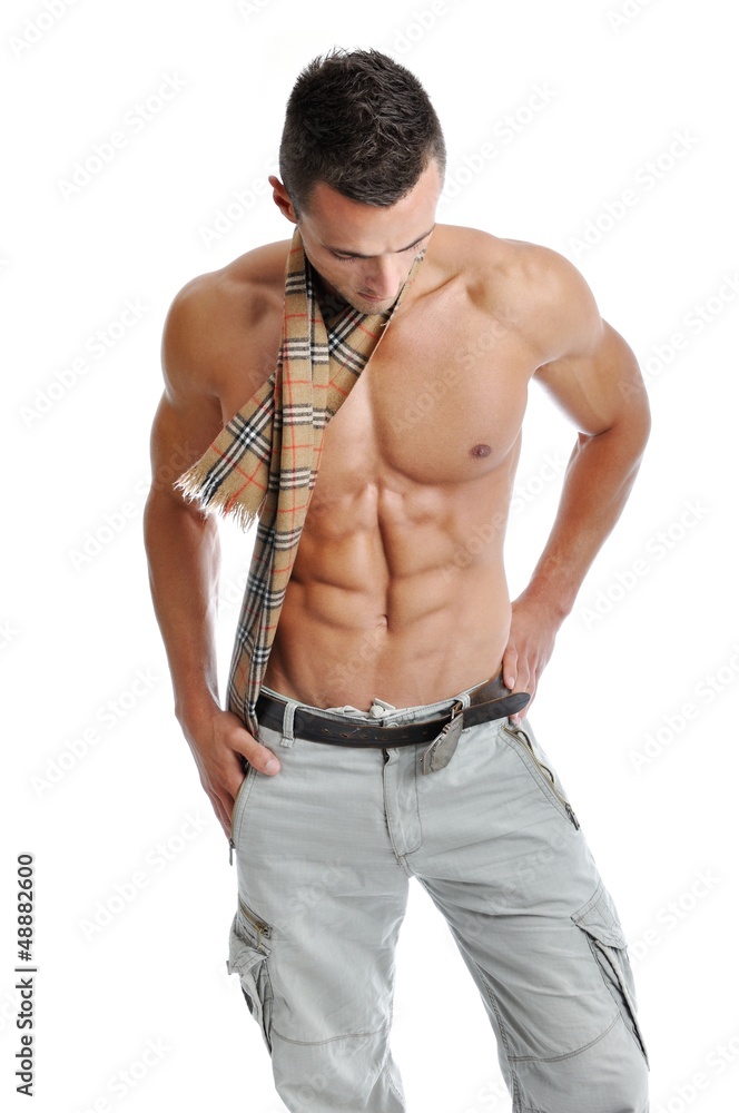 Powerful muscular man posing on a white background Powerful muscular man posing on a white background