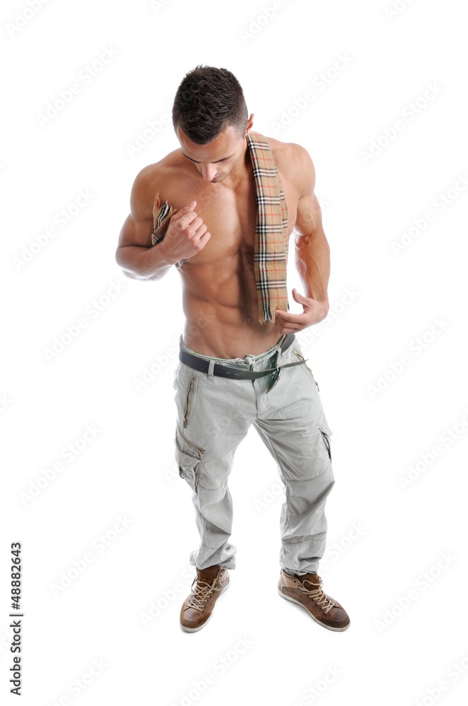 Powerful muscular man posing on a white background Powerful muscular man posing on a white background
