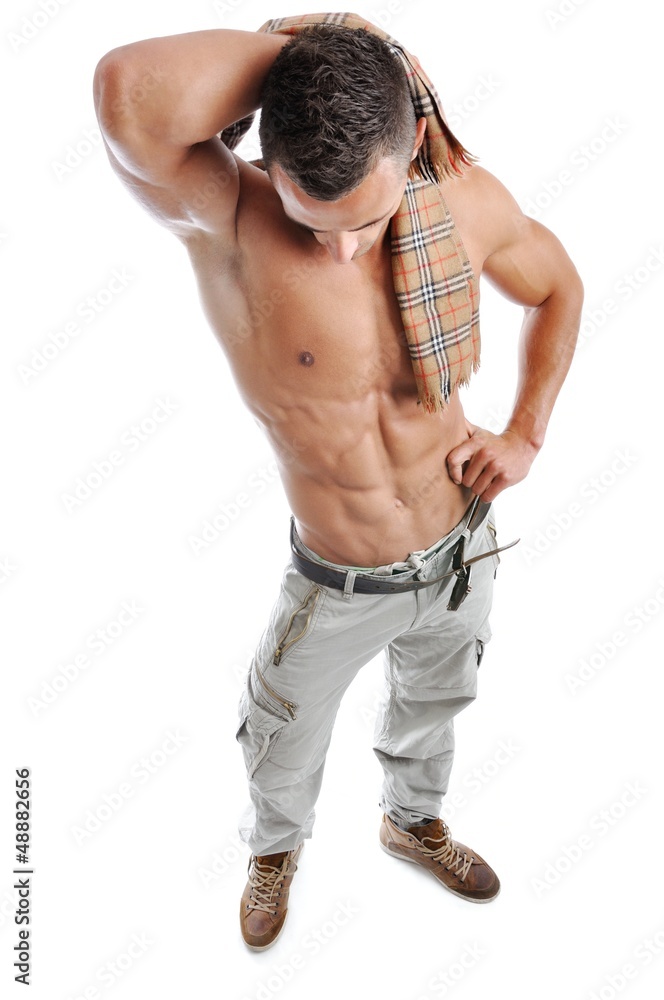 Powerful muscular man posing on a white background Powerful muscular man posing on a white background