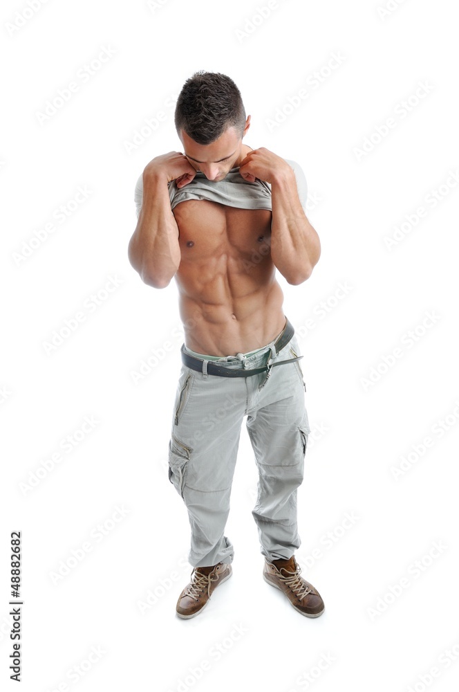 Powerful muscular man posing on a white background Powerful muscular man posing on a white background