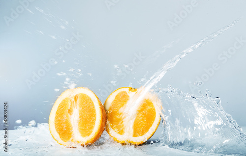 Slices of orange thrown water