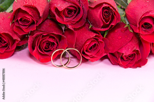 Wedding concept with roses and wedding rings