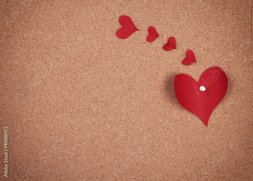 hearts on corkboard