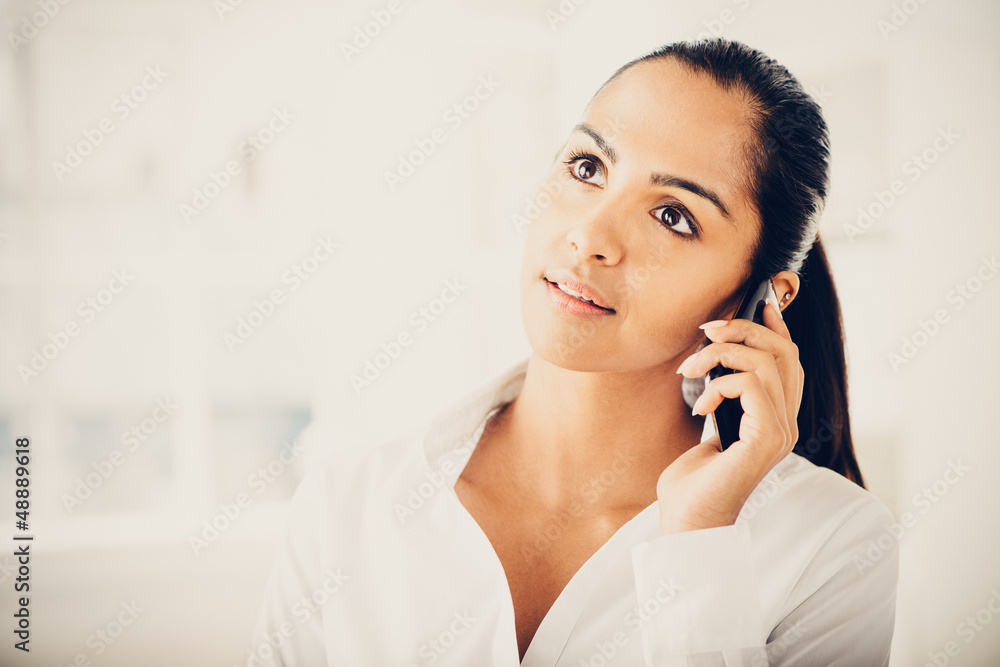 Indian business woman using mobile phone happy Indian business woman using mobile phone happy