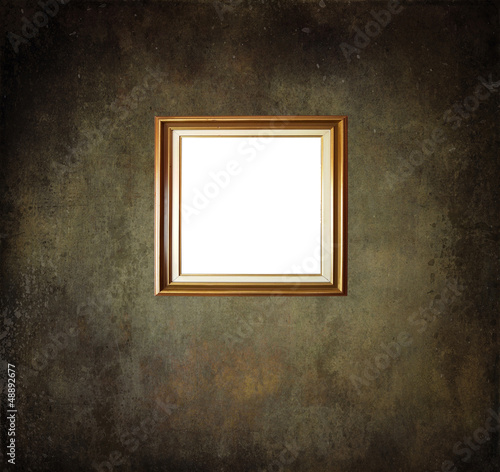 Empty frame on grunge room wall