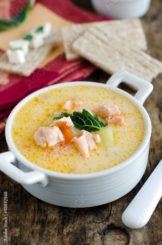 Cheese soup with vegetables and salmon