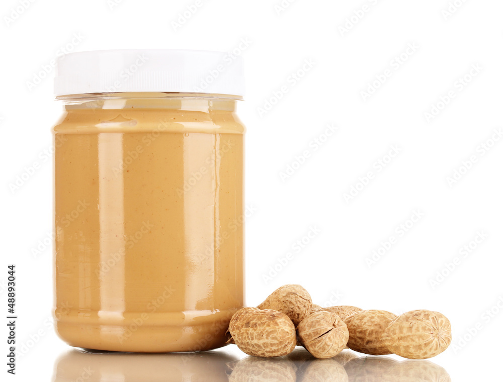 Delicious peanut butter in jar of peanut near isolated on white Delicious peanut butter in jar of peanut near isolated on white