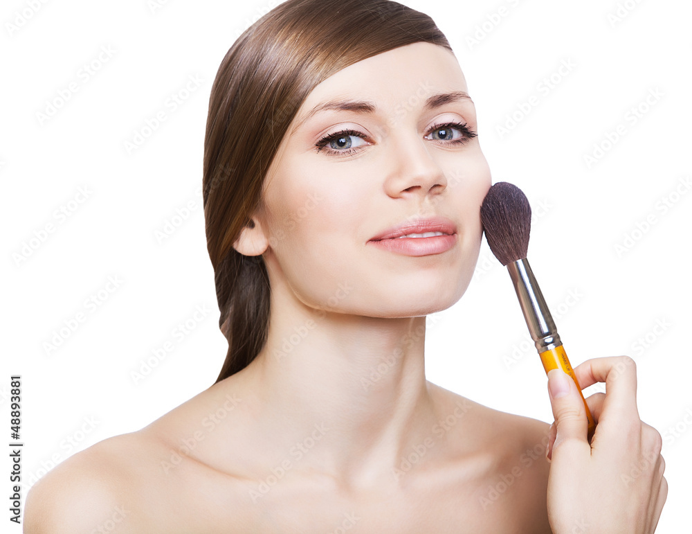 natural woman with cosmetic brush on face natural woman with cosmetic brush on face