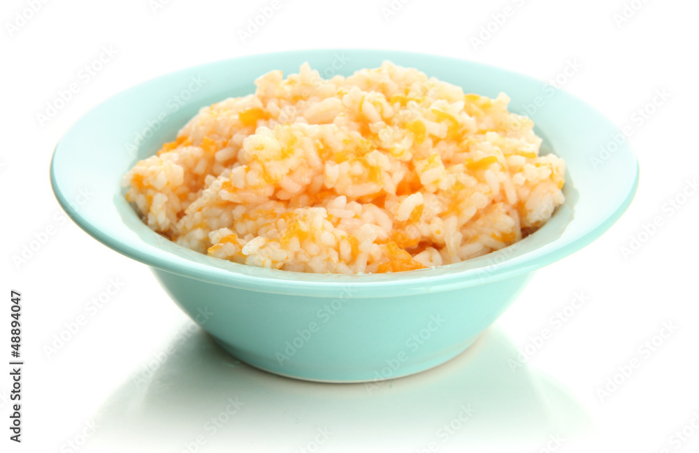 Taste rice porridge with pumpkin in blue bowl, isolated Taste rice porridge with pumpkin in blue bowl, isolated