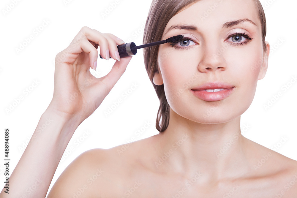 woman with mascara brush