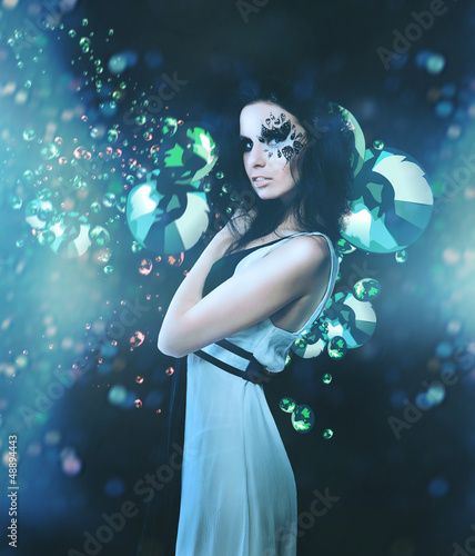 Splatter woman and diamonds on dark background © alexbutscom