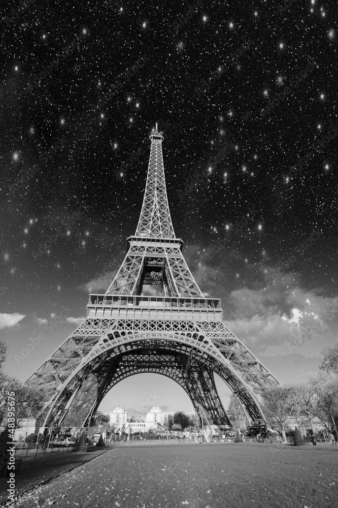 Dramatic view of Eiffel Tower with Sky on Background