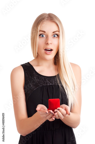 Young woman with engagement ring in box