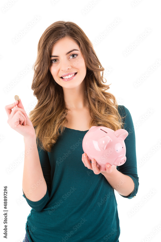 Casual woman looking to save money in a piggy bank Casual woman looking to save money in a piggy bank