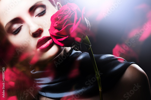 attractive woman with red rose photo