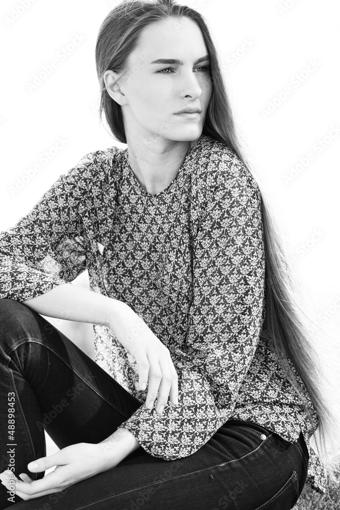 Naklejka premium A beautiful girl posing in the garden