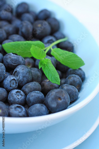 Ripe blueberries in the blue bowl