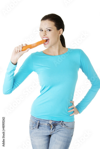 Happy beautiful woman with carrot