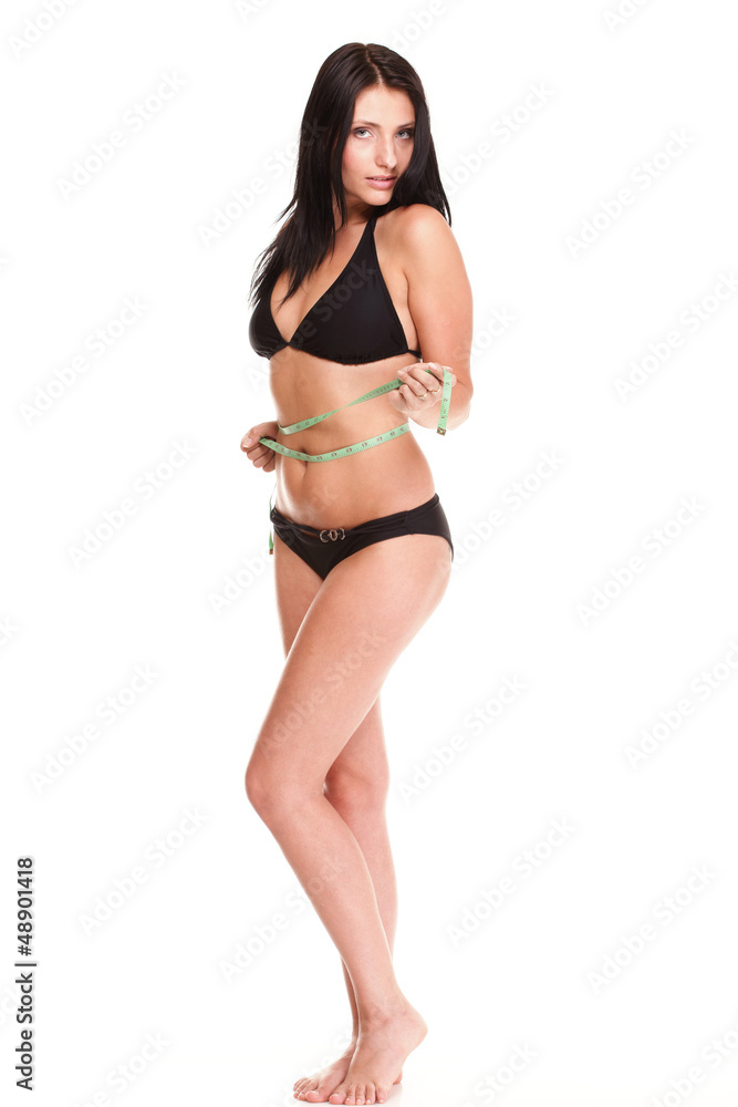 brunette girl bikini measuring waistline tape