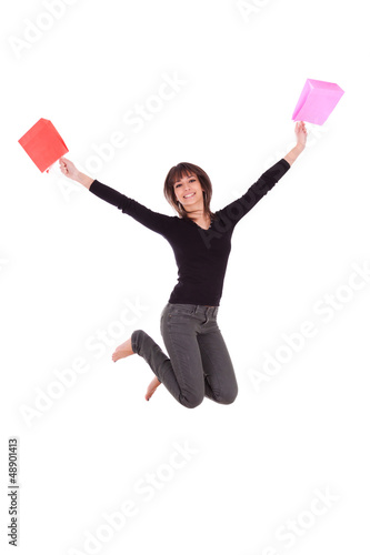 Happy caucasian woman jumping with shopping bags