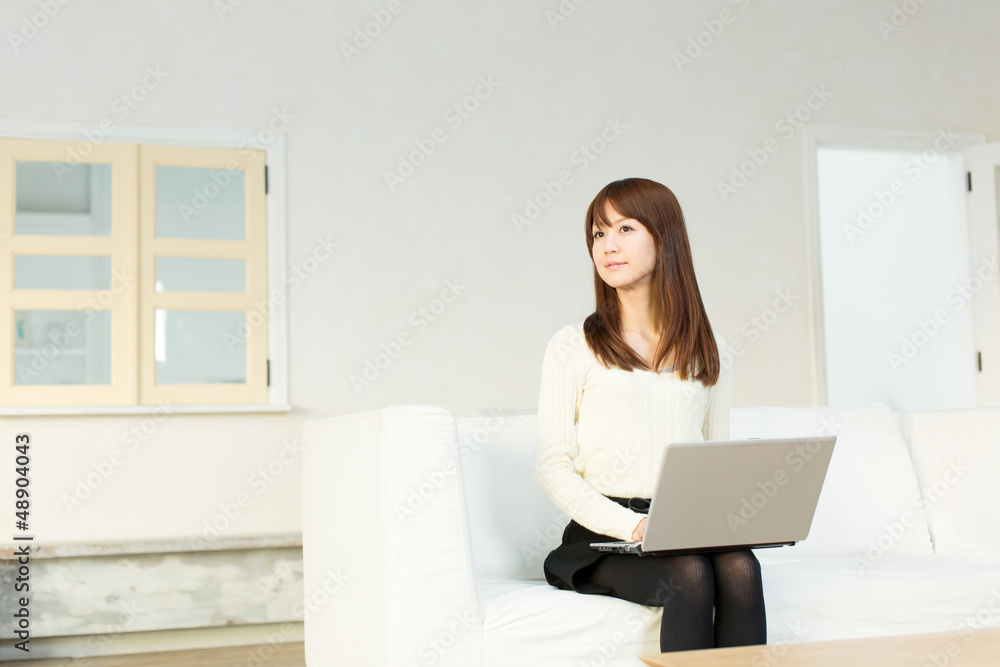 Beautiful asian woman using a laptop computer Beautiful asian woman using a laptop computer