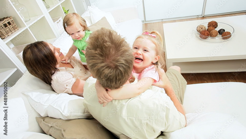 Happy Young Family Playing Together Home Couch Happy Young Family Playing Together Home Couch