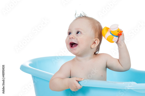baby kid taking bath and pl...