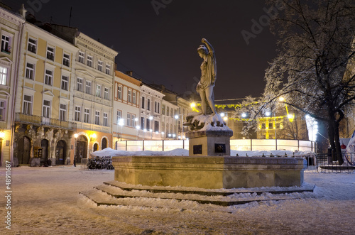 An open-air ice rink and old buildings in the center of Lvov