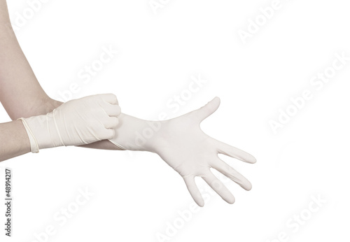 Pulling on surgical glove © Lovrencg