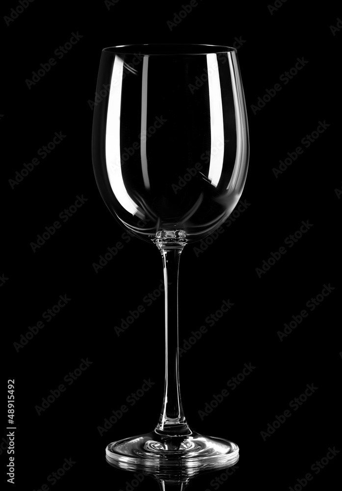 Close up of empty wine glass isolated on black background