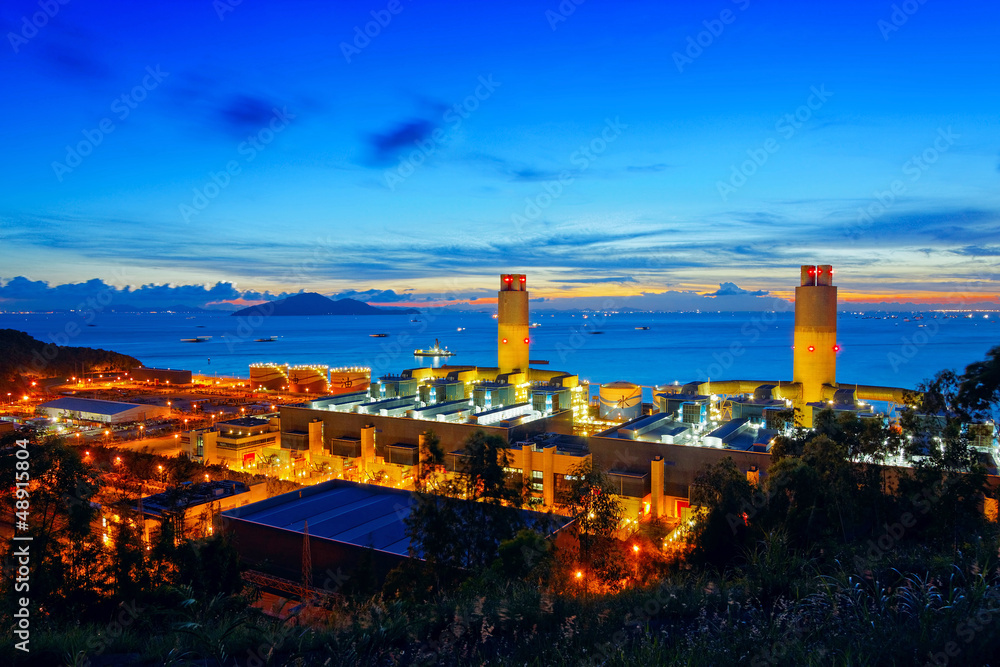 Oil and water refinery at twilight - Petrochemical factory